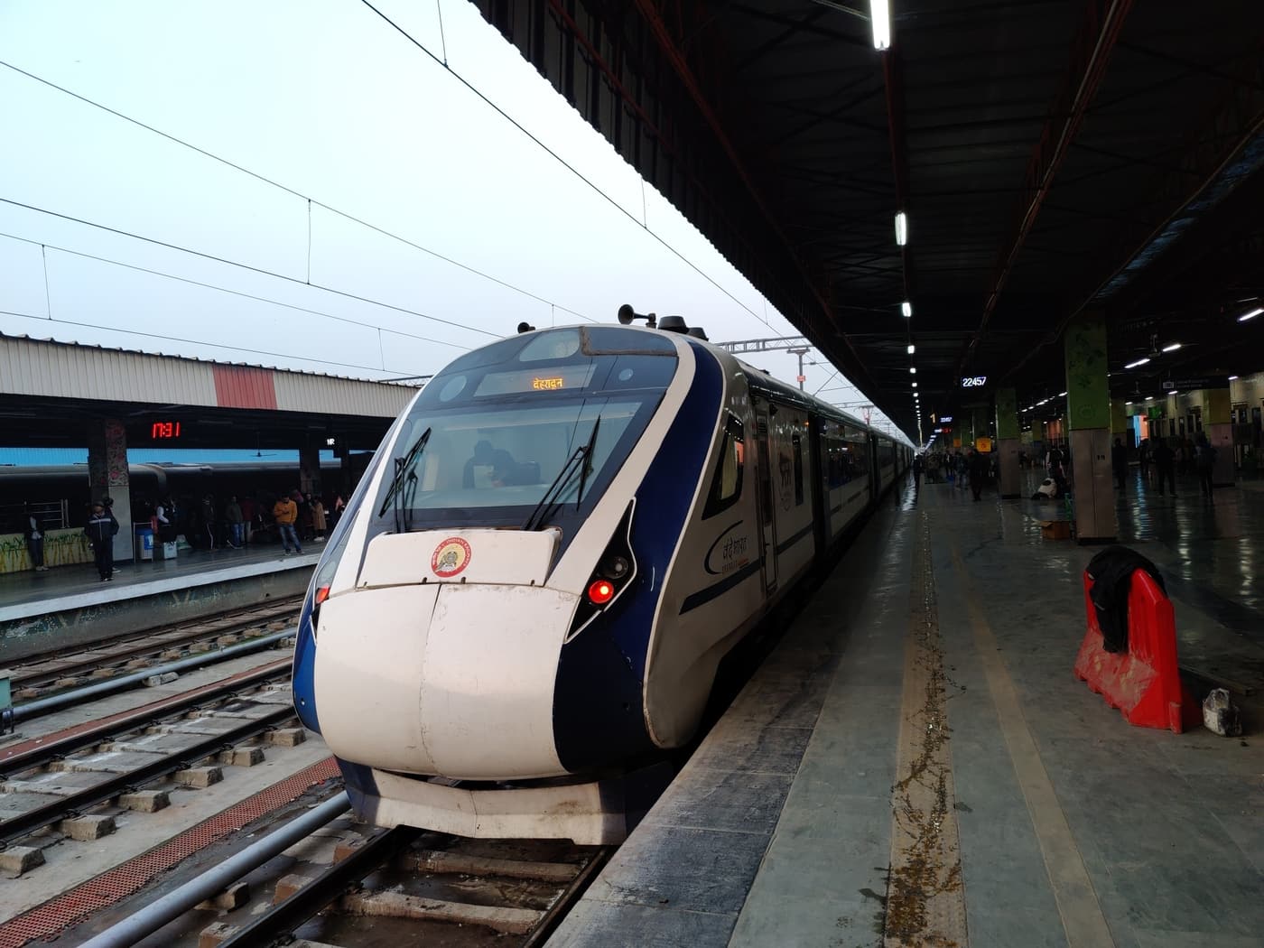 A Vande Bharat Express train standing at a platform